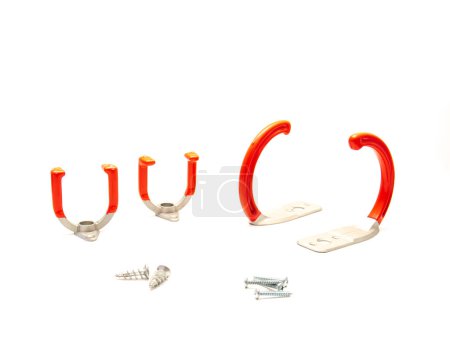 Drywall and wood stud screws in selection of garage storage utility hooks with large zinc alloy U-Hooks, J-Hooks in red finishes steel handle isolated on white background, wall mount. Clipping path