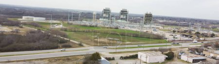 Panorama aerial view three units over thousand megawatts of natural gas fueled electric generation facility located in Fort Worth, Texas, generate electricity by burning natural gas as their fuel. USA