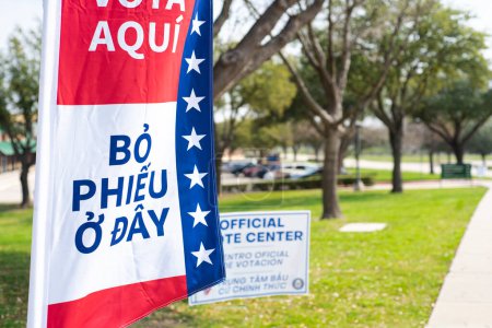 Photo for Vietnamese text Bo Phieu O Day means Vote Here on multiple languages political vote flag banner with poles, polyester double-sided election decorations polling locations, non-English-proficient. USA - Royalty Free Image