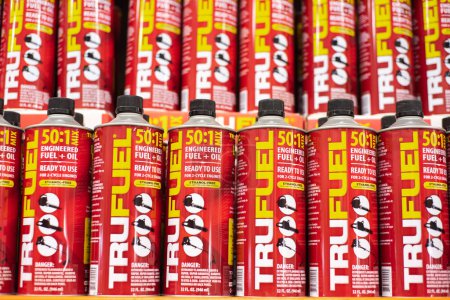 Photo for DALLAS, TX-MAR 2, 2024: Red 32oz steel container TruFuel engineered premixed fuel with synthetic lubricants, stabilizers for 2-cycle power equipment on shelves with price tags at Home Depot store. USA - Royalty Free Image