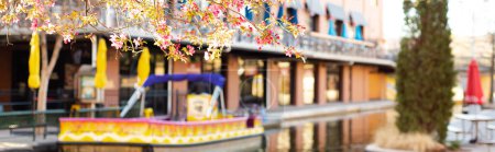 Photo for Panorama view restaurant and shopping places with outdoor seatings along canal river walk water taxi tour at Bricktown entertainment district, travel destination attractions in Oklahoma City. USA - Royalty Free Image