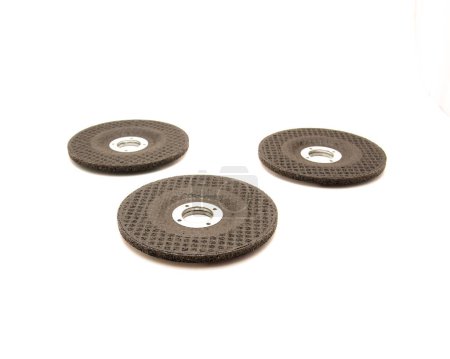 Three aluminum oxide general purpose griding wheels, manufactured with heat treated grit grains in high concentrations smooth when cutting steel and ferrous metals, stone, isolated background. White