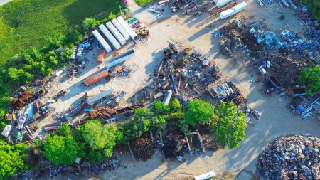 Large recycling center mound of ferrous and nonferrous scrap metals, vehicle parts, old appliances, copper, aluminum, electronic trash, Mountain Grove, Missouri, environmental risks, aerial view. USA