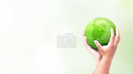 Photo for Small hands holding green earth. Ecology theme. Climate change. Rescue earth. - Royalty Free Image