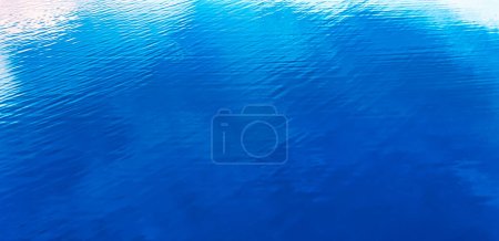 Photo for Blue water texture, on the surface of a clear blue lake. Abstract natural background. - Royalty Free Image