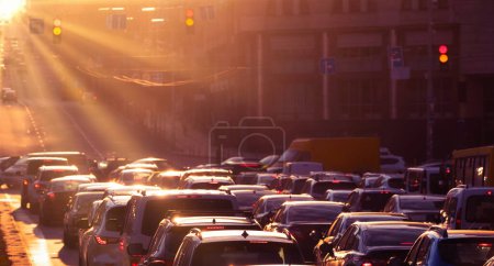 Photo for A quiet city street is transformed into a traffic-filled frenzy as commuters make their way to work in this stunning morning photograph - Royalty Free Image