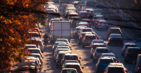 The daily grind of the morning commute is brought to life in this photo, depicting the frenzied pace of cars as they navigate the busy city streets