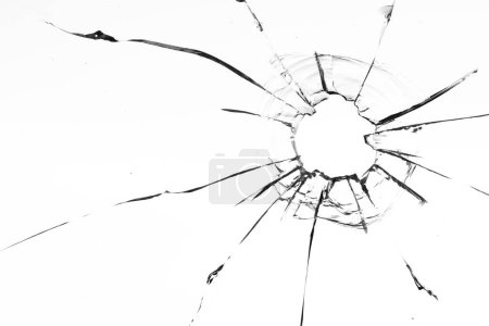 Foto de Ventana de vidrio dañada por bala con intrincado patrón de grietas - Imagen libre de derechos