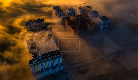 Urban Fog Ballet: Dancing Towers in the Mist from an Aerial View