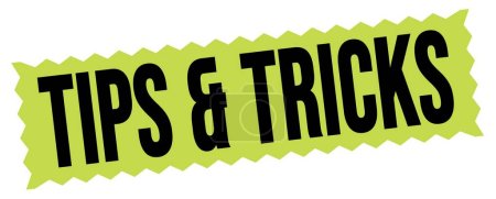 Téléchargez les photos : TIPS & TRICKS text written on green-black zig-zag stamp sign. - en image libre de droit