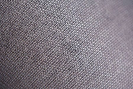 Photo for A close up macro portrait of a texture of the threads which form rectangle shaped patterns in the fabric and material of black nylon pantyhose, hosiery, stockings or tights. - Royalty Free Image