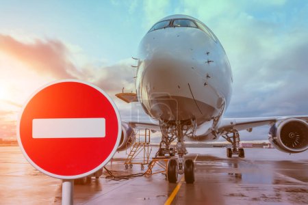 Stop sign red circle brick and blocked plane. Fly ban concept