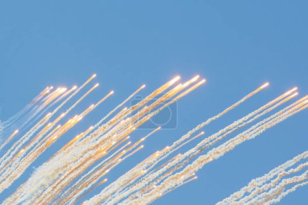 Photo for Outbreaks of warfare in the sky with explosives and smoke, fragments fly up - Royalty Free Image