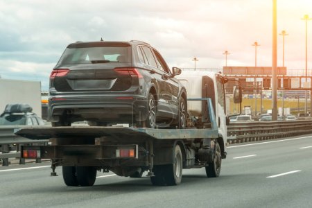 Photo for Car Service Transportation Concept, transporting Car On Motorway Freeway Highway. Help On Road. Transportation Faults And Emergency Cars - Royalty Free Image