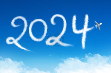 Happy New year 2024 concept enjoy travel on the blue background below cloudscape. Drawing by passenger airplane vapor steam contrail in sky