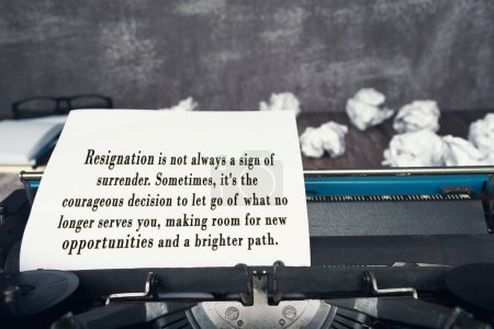 Motivational and inspirational quote on an old typewriter with trash paper background.