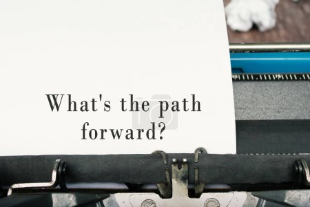 What is the path forward text on an old blue typewriter. Business concept.