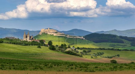Photo for The ruins of Spis Castle in eastern Slovakia form one of the largest castle sites in Central Europe. The castle is situated above the town of Spisske Podhradie with Spisska Kapitula - Royalty Free Image