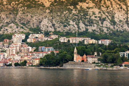Photo for The Church of St. Matthew 1670 with the bell tower and the Church of the Merciful Virgin 15th century along the Boka Bay of Kotor, Dobrota, Montenegro. - Royalty Free Image