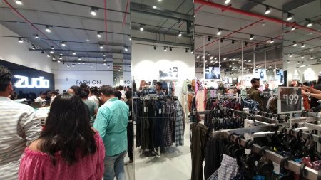 Photo for Mumbai, India, March 2023: Large number of customers inside the Zudio apparel store in one of the Mumbai mall. Zudio is a value apparel store started by TATA group, India to target mid income segment - Royalty Free Image