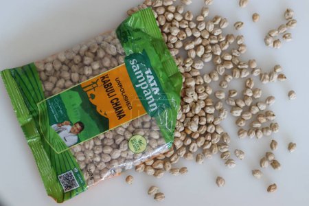 Photo for Mumbai, India, April 2023: Tata Sampann Unpolished chick pea, half kg packet. Chick pea is also known as gram or Bengal gram, chana, garbanzo bean or Cicer arietinum or Egyptian pea - Royalty Free Image