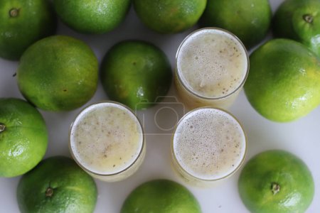 Photo for Refreshing sweet lime with nutritious chia seeds, perfect for a healthy lifestyle. Citrus delight with a boost of omega 3. Energize your day naturally. Shot along with ripe sweet limes around - Royalty Free Image