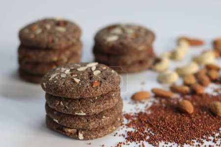 Ragi Cookies or Finger Millet Cookies. Delight in wholesome goodness with these delectable finger millet cookies topped with almonds and cashews. A nutritious treat for health conscious food lovers.