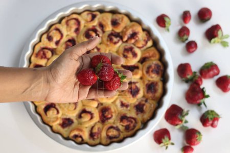 Strawberry Cream Cheese Pull Apart Bread, a tempting sweet treat, perfect for breakfast or dessert. Fresh berries, rich cream cheese, and golden brown bread create a mouthwatering culinary masterpiece