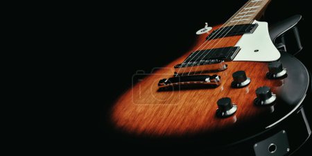 Foto de Close-up detail of electric guitar with wood grain and black trim in studio 3d render and illustration. - Imagen libre de derechos