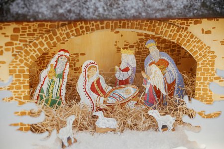 Photo for Nativity scene. Holy night scene with saint figurines and baby Jesus in creche.Christmas decor in city street. Winter holidays in Europe. Merry Christmas - Royalty Free Image