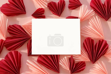Photo for Empty card and stylish red and pink hearts flat lay on pink paper background. Creative modern valentines greeting card mock up with space for text. Happy Valentine's day! Love letter - Royalty Free Image
