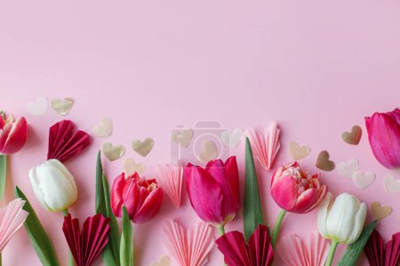 Photo for Valentine flat lay. Stylish pink and red hearts and tulips border on pink background. Happy Valentines day and happy mothers day. Greeting card and banner template, space for text - Royalty Free Image