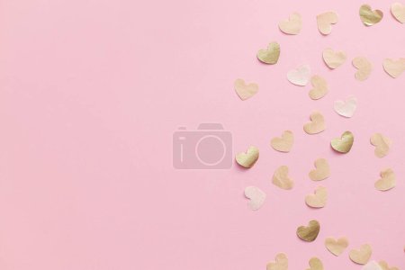 Photo for Valentine flat lay. Stylish gold hearts border on pink background. Happy Valentines day and happy mothers day. Greeting card and banner template, space for text - Royalty Free Image