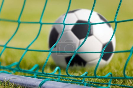 Photo for Classic soccer ball in a goal. Football stadium, ball, soccer, football pitch - Royalty Free Image