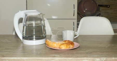 Photo for Croissants and a cup for coffee prepared for breakfast and set on a table breakfast - Royalty Free Image