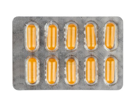 Photo for Yellow pills in a plastic blister package on white background - Royalty Free Image