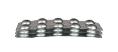 Photo for Tablets in silver blister packages isolated from background - Royalty Free Image