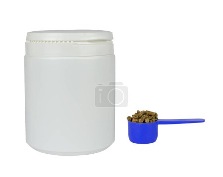 Photo for White plastic container and blue, measuring scoop with veterinary supplement isolated from background - Royalty Free Image