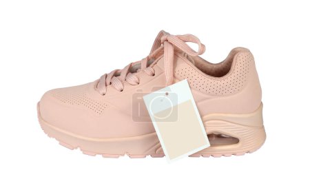 Photo for Woman's sneaker with a sale tag or a price card isolated from background. Pink color. Profile view - Royalty Free Image