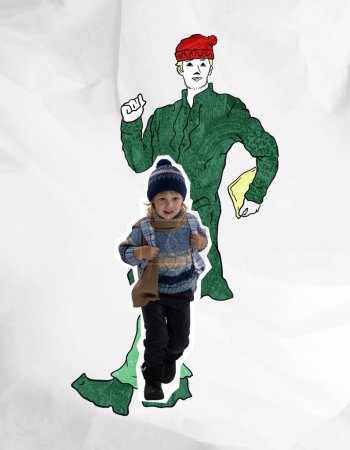 Photo for Happy cute kid wearing warm winter clothes running over drawn portrait of dancing man. Concept of inner child, childhood and dreams. Happiness, carefreeness, fun - Royalty Free Image