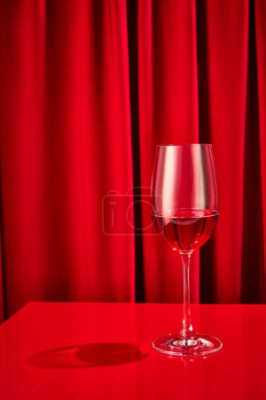 Photo for Close up photo of sweet red, pink seasoned wine served in high glass classy on bar counter at restaurant. Concept of night life, party time, holidays, Valentines Day, celebration. Ad - Royalty Free Image