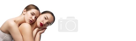 Photo for Banner. Beauty unity. Portrait of two young beautiful girls with clean eye makeup against white studio background. Concept of dermatology, youth, self care, wellness, spa. Negative space for ad. - Royalty Free Image