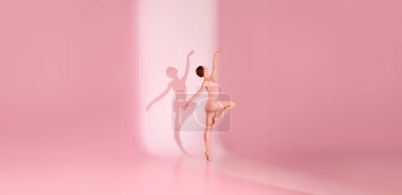 Photo for Serene Ballet. Dancer, dressed in pink attire, poses barefoot against pastel background. Shadow mirrors her tranquility. Concept of ballet, serenity, grace, beauty and art, reflection. - Royalty Free Image
