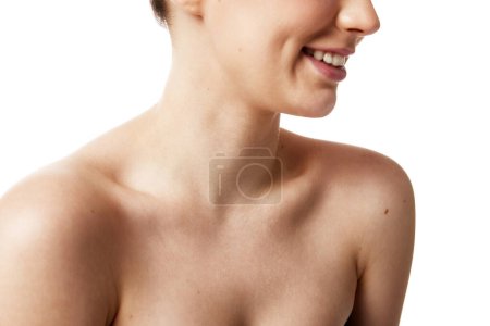 Crop portrait of young Caucasian woman with naked shoulders against white studio background. Concept of natural beauty people, injections, wellness, spa procedures, cosmetology. Ad