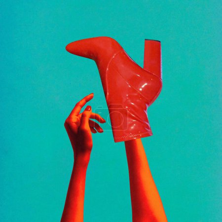Zeitgenössische Kunst. collage. Rote Hände, die elegant zu roten Stöckelschuhen am Arm vor blauem Hintergrund greifen. Gleichgewicht und Ausgeglichenheit. Konzept von Stil, Schönheit und Mode, moderner Lebensstil.