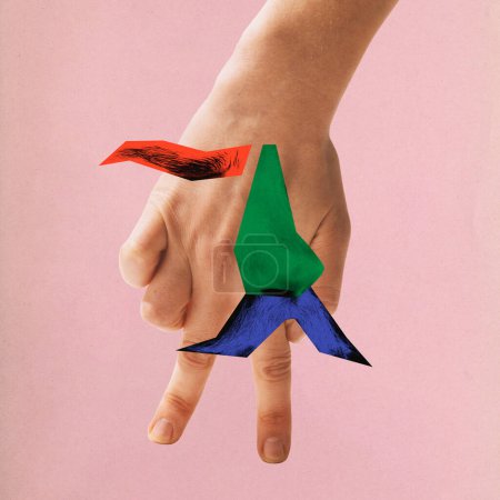 Contemporary art. collage. Ability to create and release. Hand with colorful pieces simulating human on fingers against pink background. Concept of ideas, creativity, inspiration, imagination.
