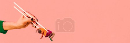 Photo for Banner. Contemporary art collage. Female hand holding chopsticks with woman as food against pink background with negative space. Concept of food and drink, vegetarian, vitamins, energy, nutrition. Ad - Royalty Free Image