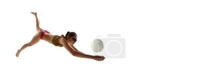 Photo for Banner. Young athlete woman, beach volleyball player passes ball in motion against white background. Negative space. Concept of sport games, movement, championship, power and strength, dynamic, energy - Royalty Free Image