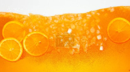 Textured photo. Orange slices nestled in chilled glass of cold, refreshing, sweet and sour lemonade drink. Abstract wallpaper. Concept of food and drinks, summer,vitamins, nutrition.