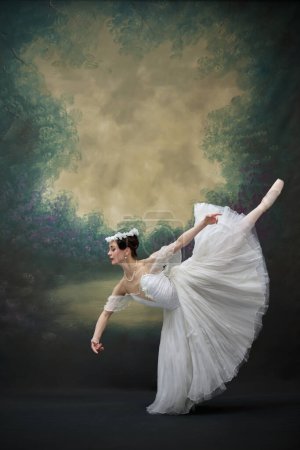 Beautiful ballerina in white costume performs, creating atmosphere of lightness and beauty. Dancer in scene of famous performance against vintage background. Concept of fusion of classic and modernity